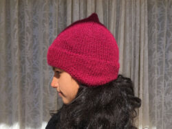 magenta hand knit beanie with ear muffs