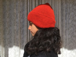 red hand knit beanie with ear muffs