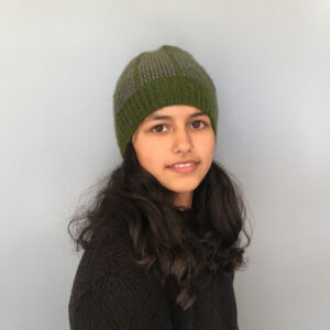 Beanie with a sap green base colour and grey dash pattern