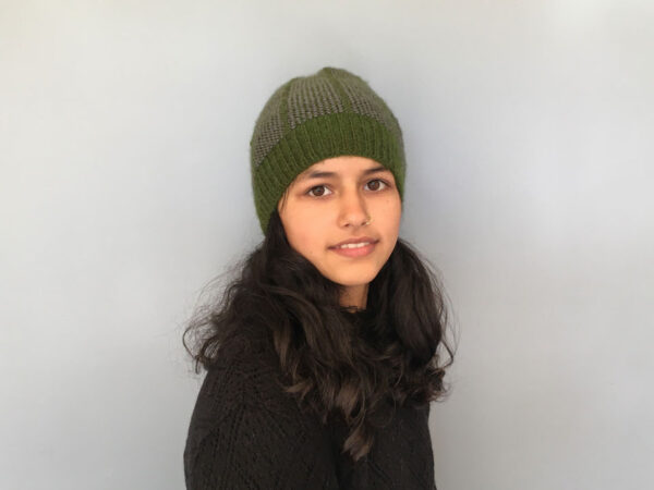 Beanie with a sap green base colour and grey dash pattern