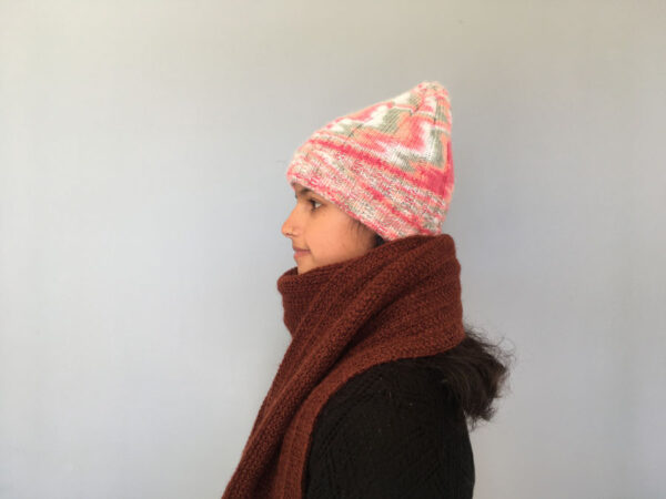 hand knit striped, ribbed beanie in shades of pink
