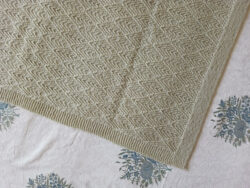 hand knit baby blanket in a deodar lace pattern